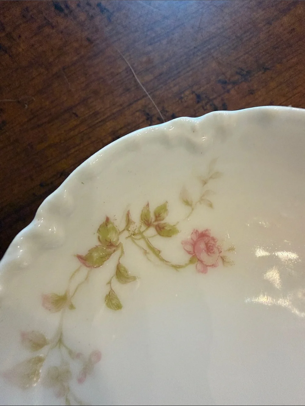 Haviland Limoges butter pat 3” with a beautiful scalloped edge